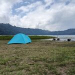 Camping beside Lake Tamblingan in North Bali surrounded by tropical forest
