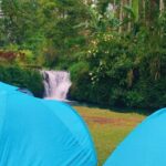 Camping near Tibuan Waterfall in North Bali surrounded by tropical forest
