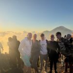 Clients reaching the summit of Mount Batur shortly before sunrise