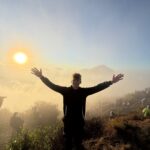 Clients enjoying a beautiful sunrise from the summit of Mount Batur