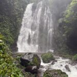 Hikers exploring hidden waterfalls during the Munduk Waterfalls Trek in Bali.