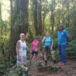 Outdoor adventurers hiking through the pristine jungle of Mount Lesung