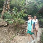 Family discovering clove and cacao plants while exploring the tropical landscape of North Bali