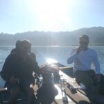 Having coffee on canoeing at tamblingan lake