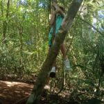 Family enjoying a playful jungle swing surrounded by tropical trees during a Twin Lake Jungle Trekking tour guided by a knowledgeable local guide.
