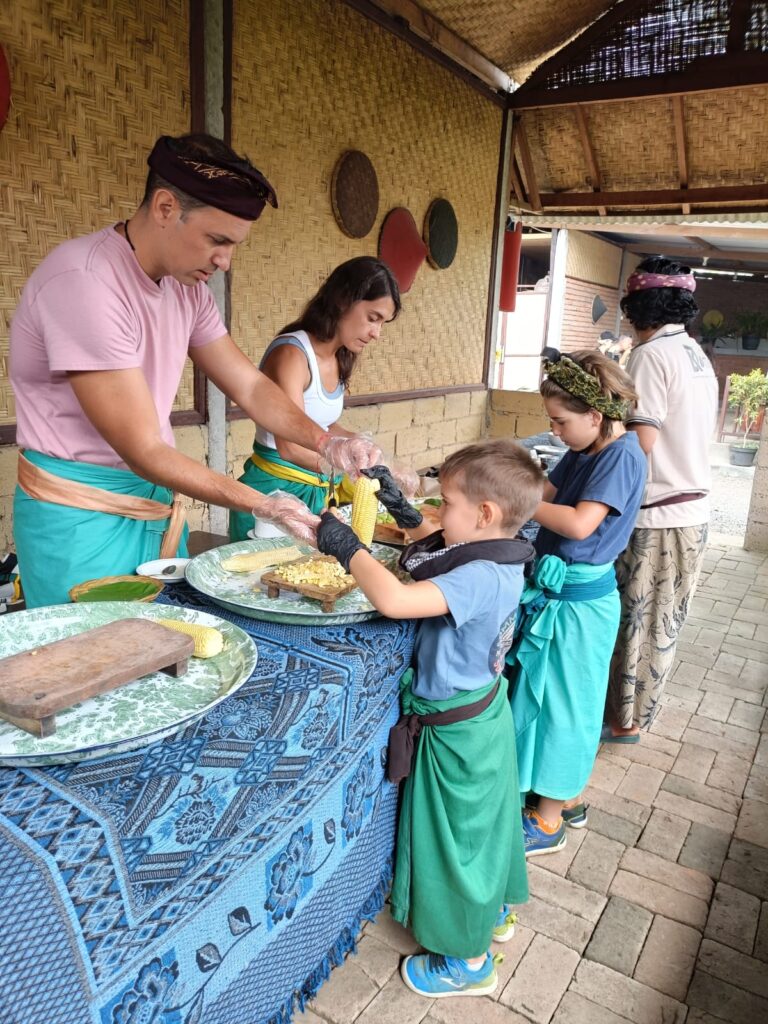 Traveler cooking traditional Balinese food together with a local person from Munduk village